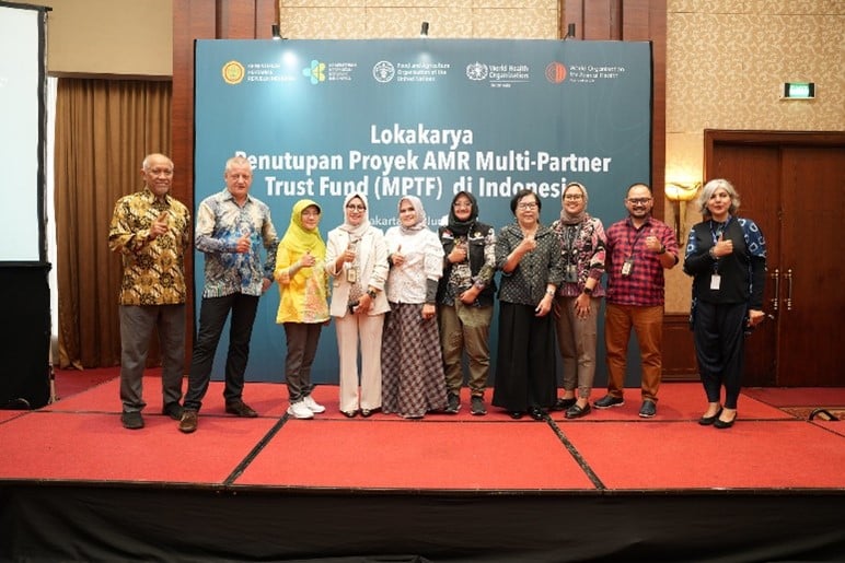 Group photo on stage of the MPTF project closing.