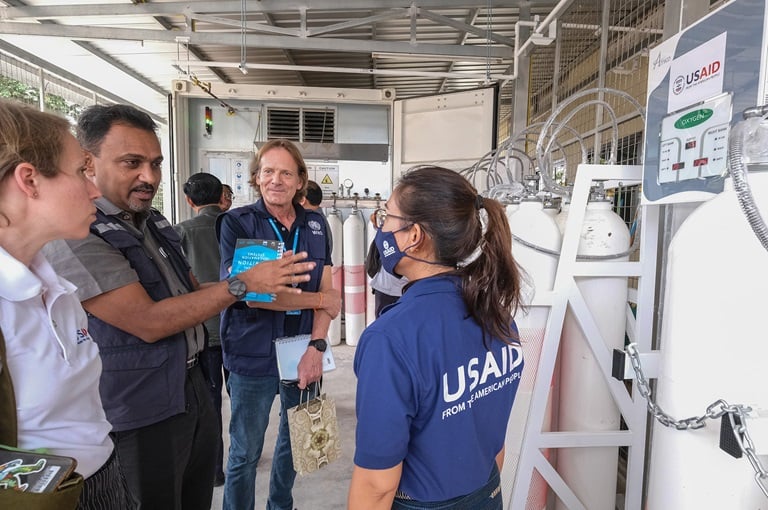 man checking the oxygen tanks