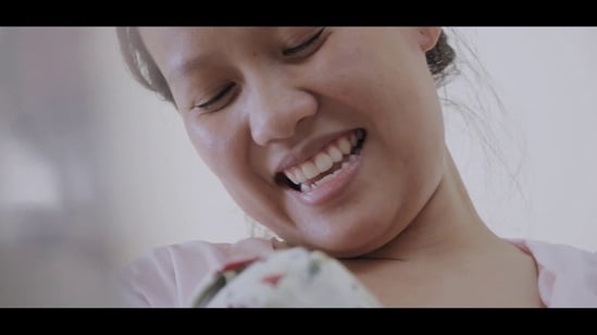 Mother smiles at her baby